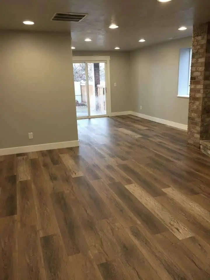 Inviting room with wood floors and fireplace, exuding warmth and coziness.