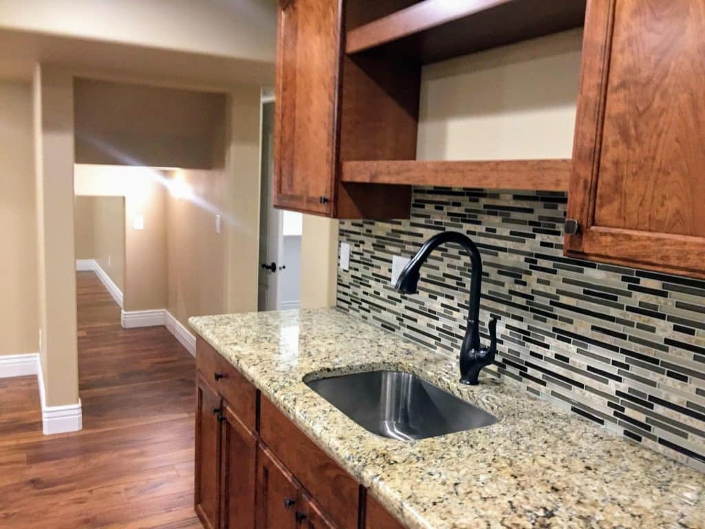 Kitchen with granite counter tops and wood cabinets