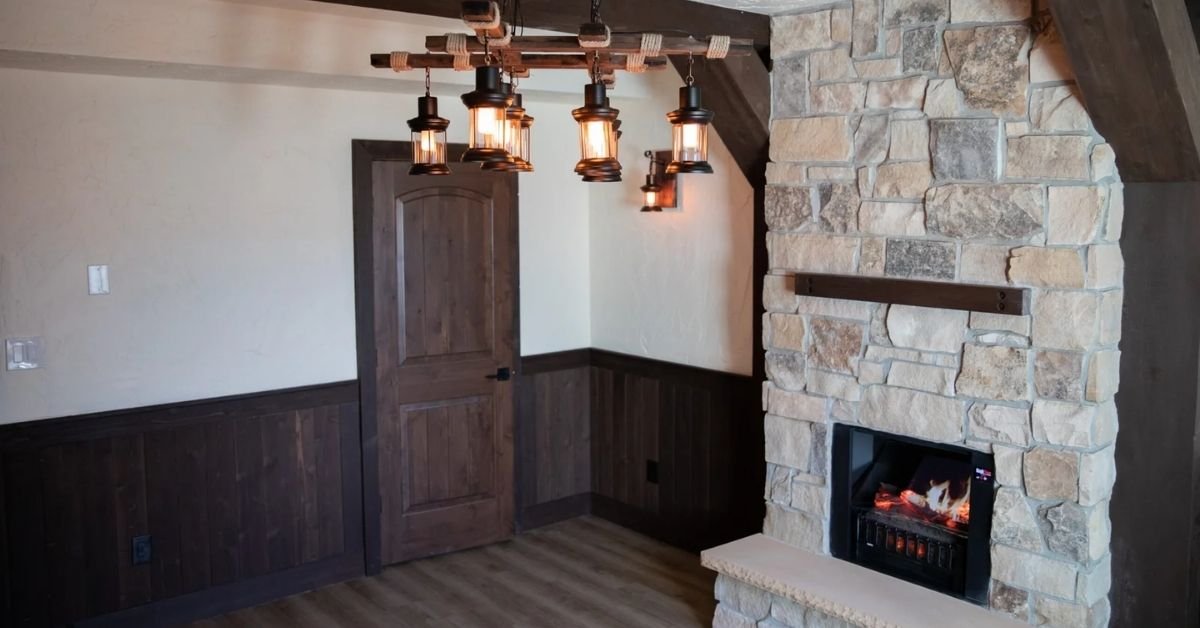 basement fire blocking requirements in south jordan, utah 2 cozy rustic living room featuring a stacked stone fireplace and a chandelier