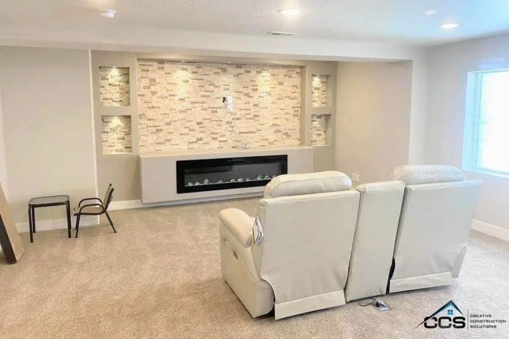 modern finished basemententertainment space with custom built-in entertainment center
