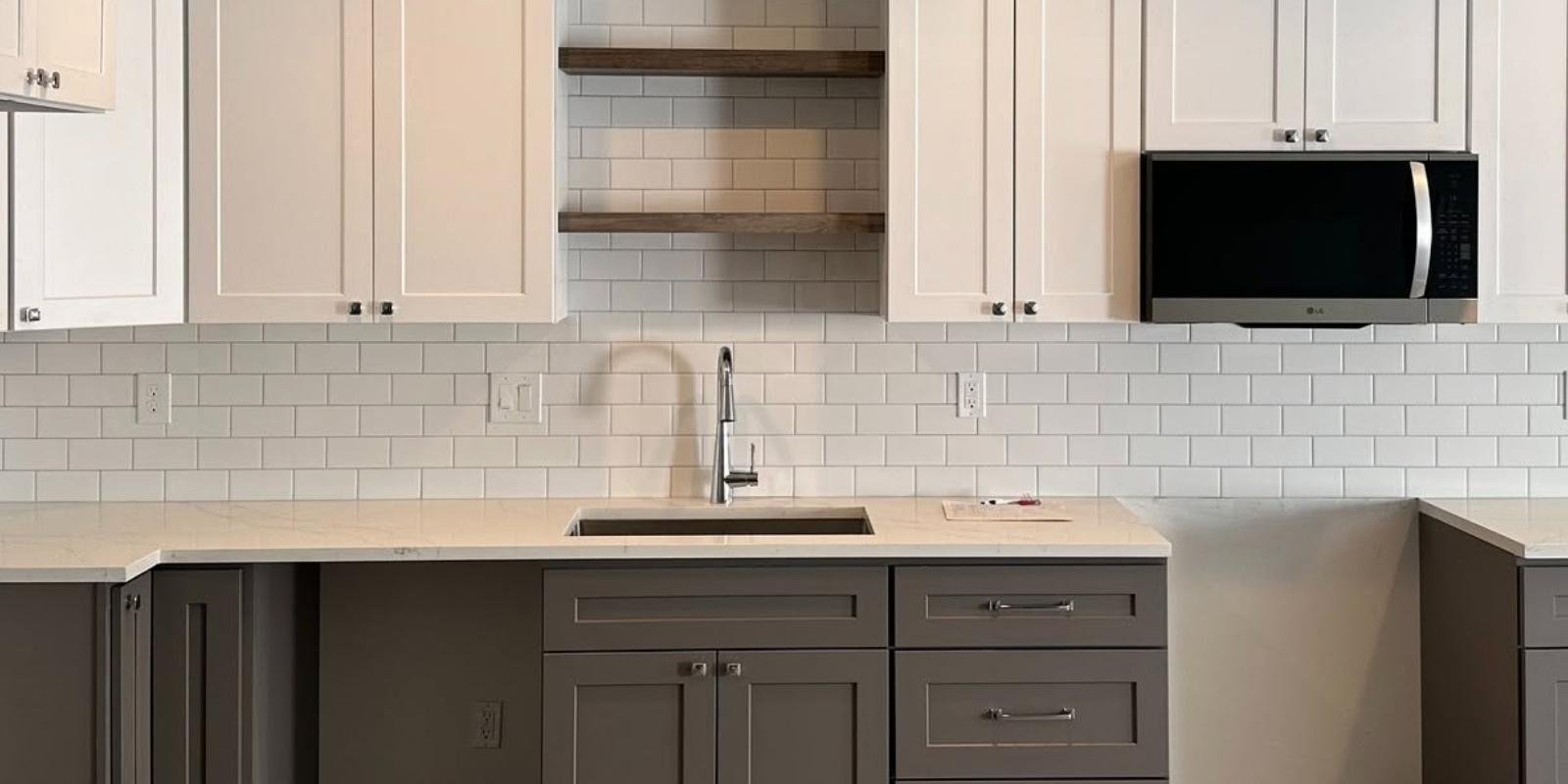 Full basement kitchen with subway tile backsplash that passed the basement remodeling building code Bluffdale Utah inspection process