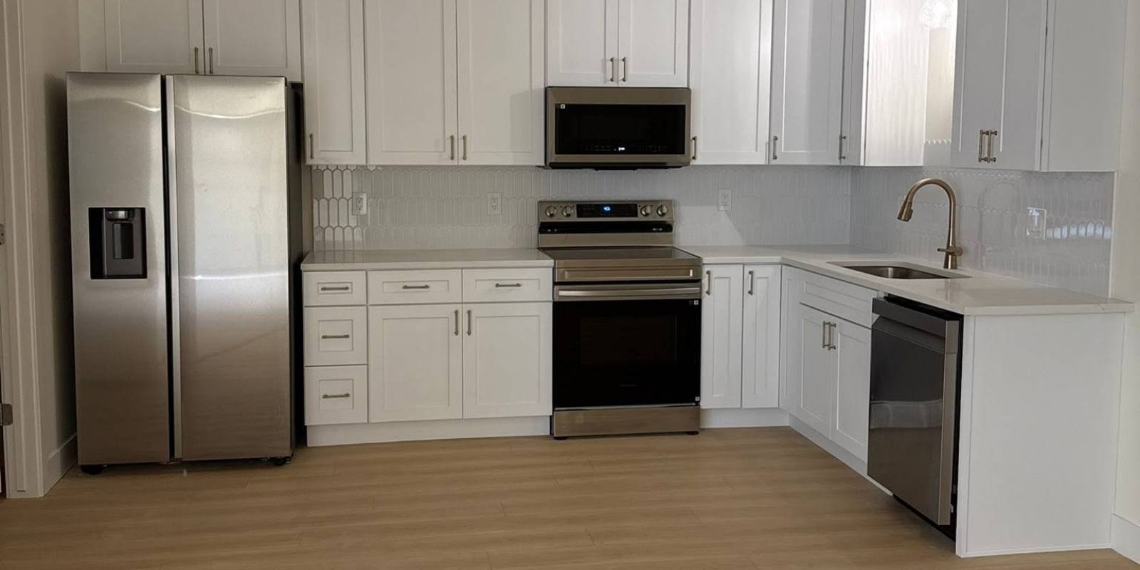 basement remodeling building code bluffdale, utah: what homeowners need to know 2 Full basement kitchen with modern appliances integrated into the cabinetry, closely following the basement remodeling building code Bluffdale Utah compliance guide